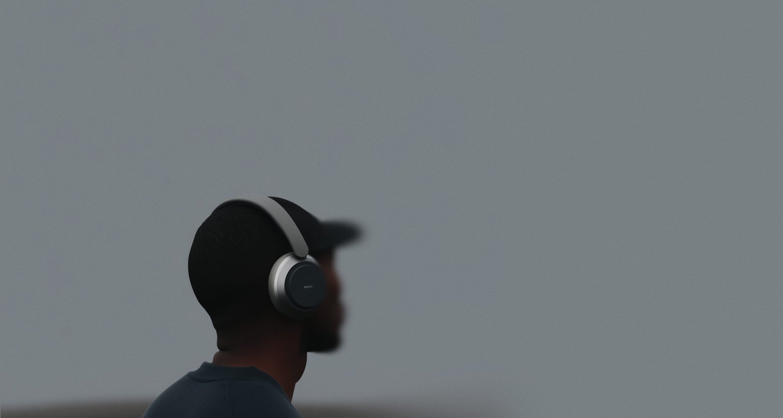 A man with headphones on his ears.
